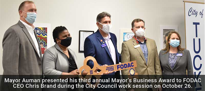 Mayor Auman presents Business Award to FODAC.