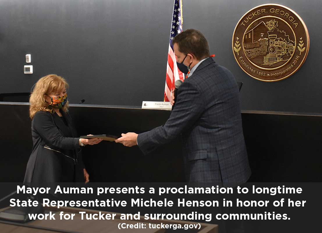 Mayor Auman presents proclamation to State Rep Michelle Henson.