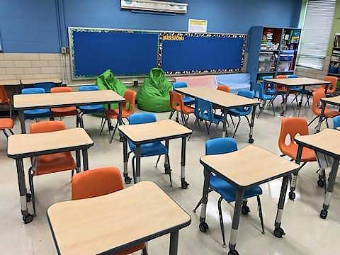 Ms. Watts classroom features colorful chairs.