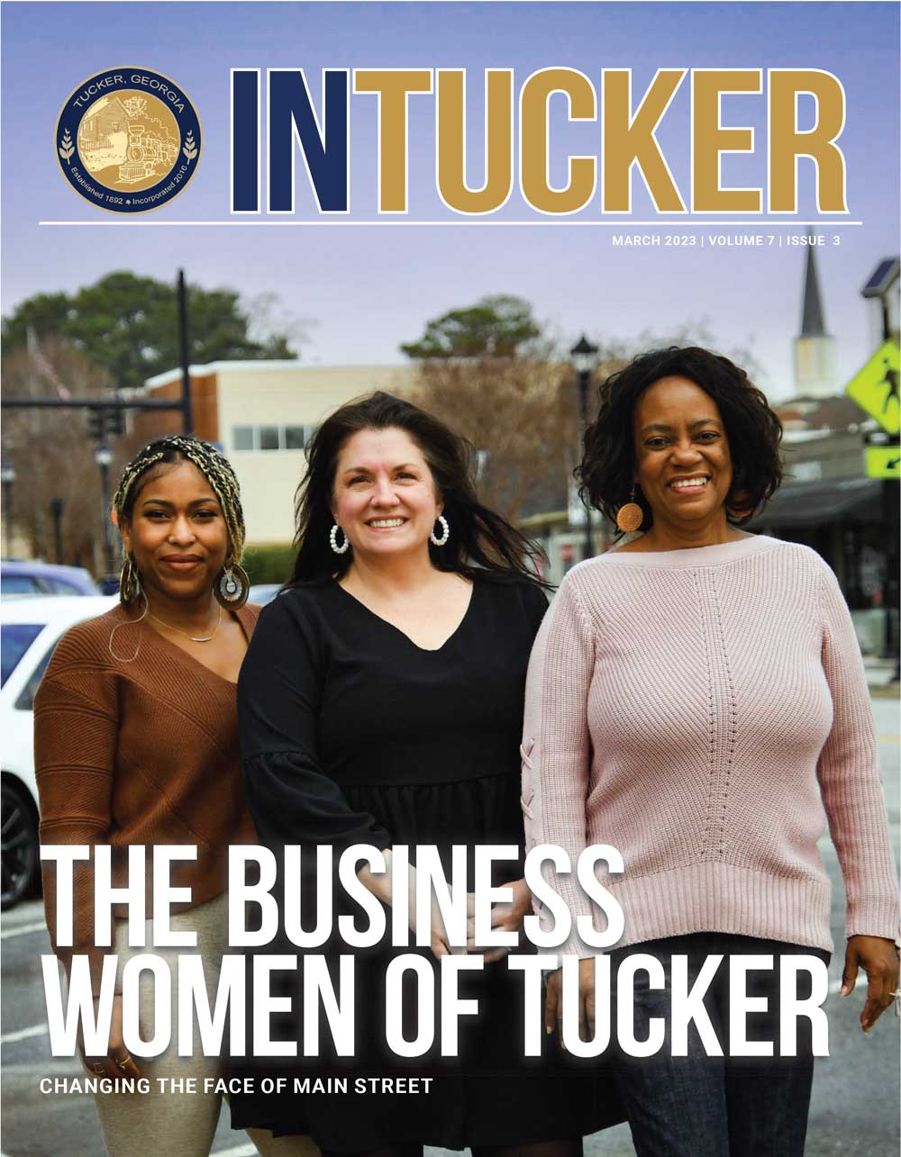 InTucker Cover of March 2023 shows three smiling business women on Main Street.