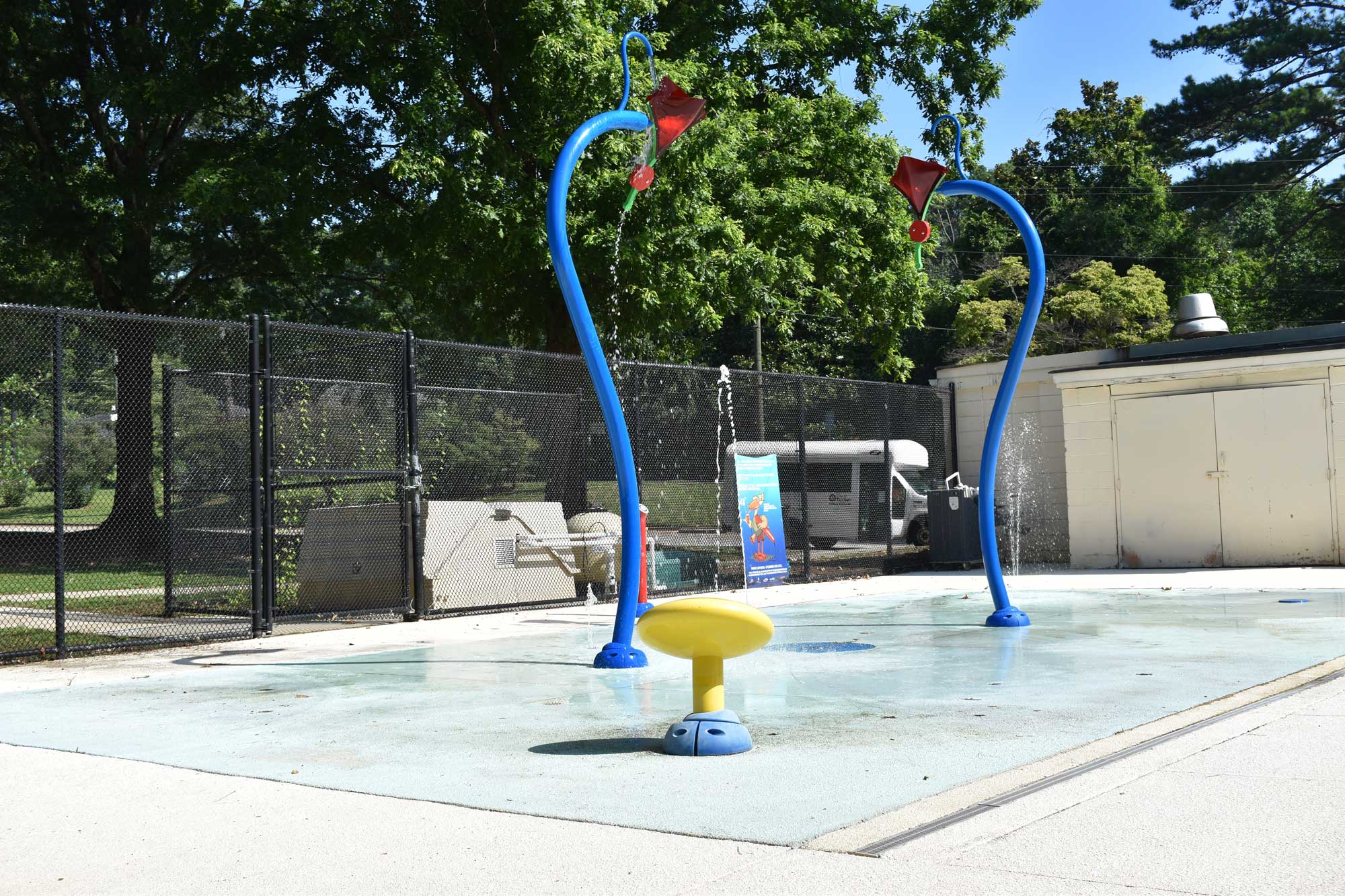 Splashpad area with sprinklers at Cofer Pool.