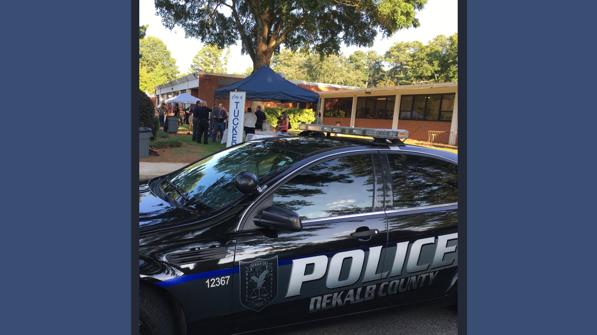 DeKalb Police car at public event.