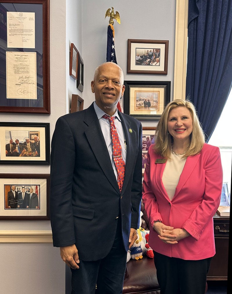 Congressman Hank Johnson and Councilmember Virginia Rece pose for a photo in his office.