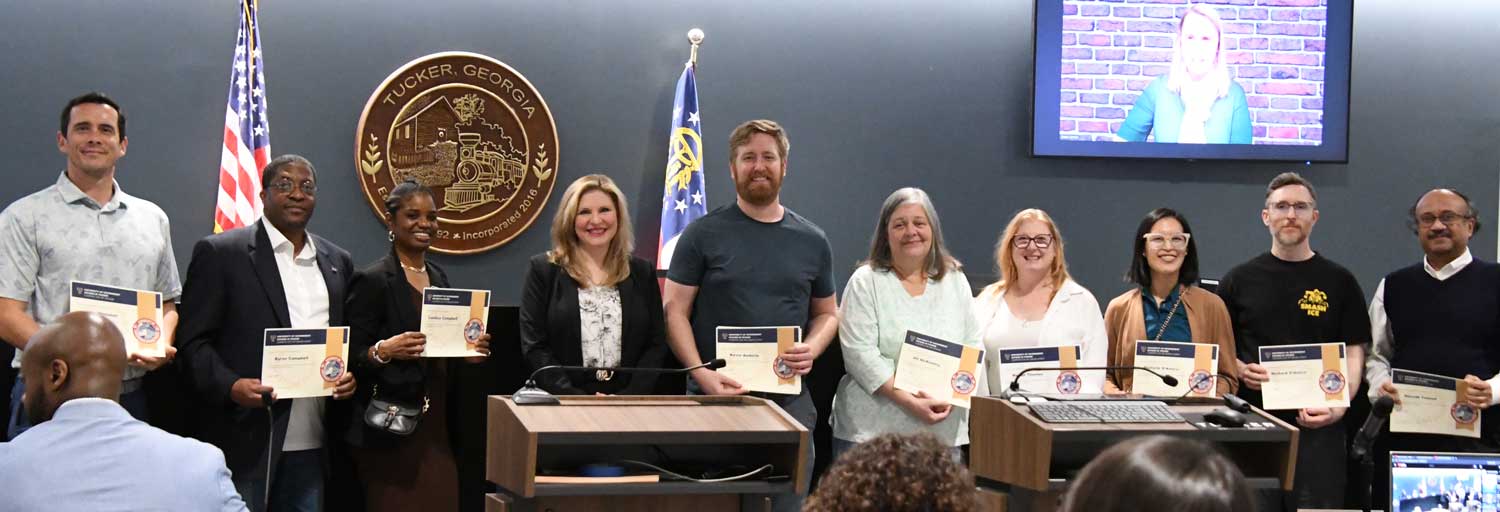 TKR 101 graduates receive their certificate from Mayor Pro Tem Virginia Rece.