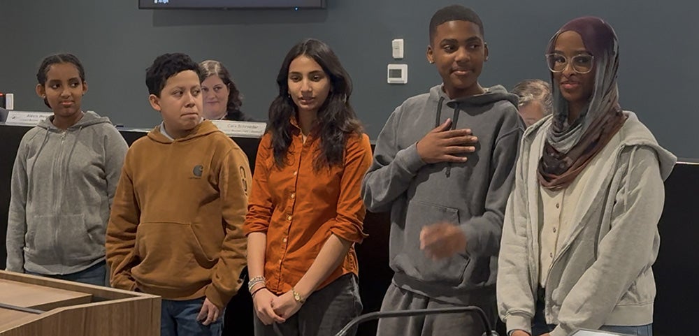 Tucker Middle STEM students lead the Pledge of Allegiance at a City Council Meeting.