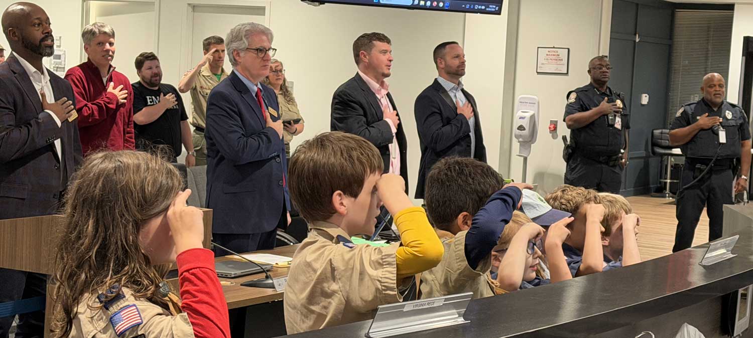 Boy Scout Troop 129 leads the Pledge at the October 26,2026 Tucker City Council meeting.